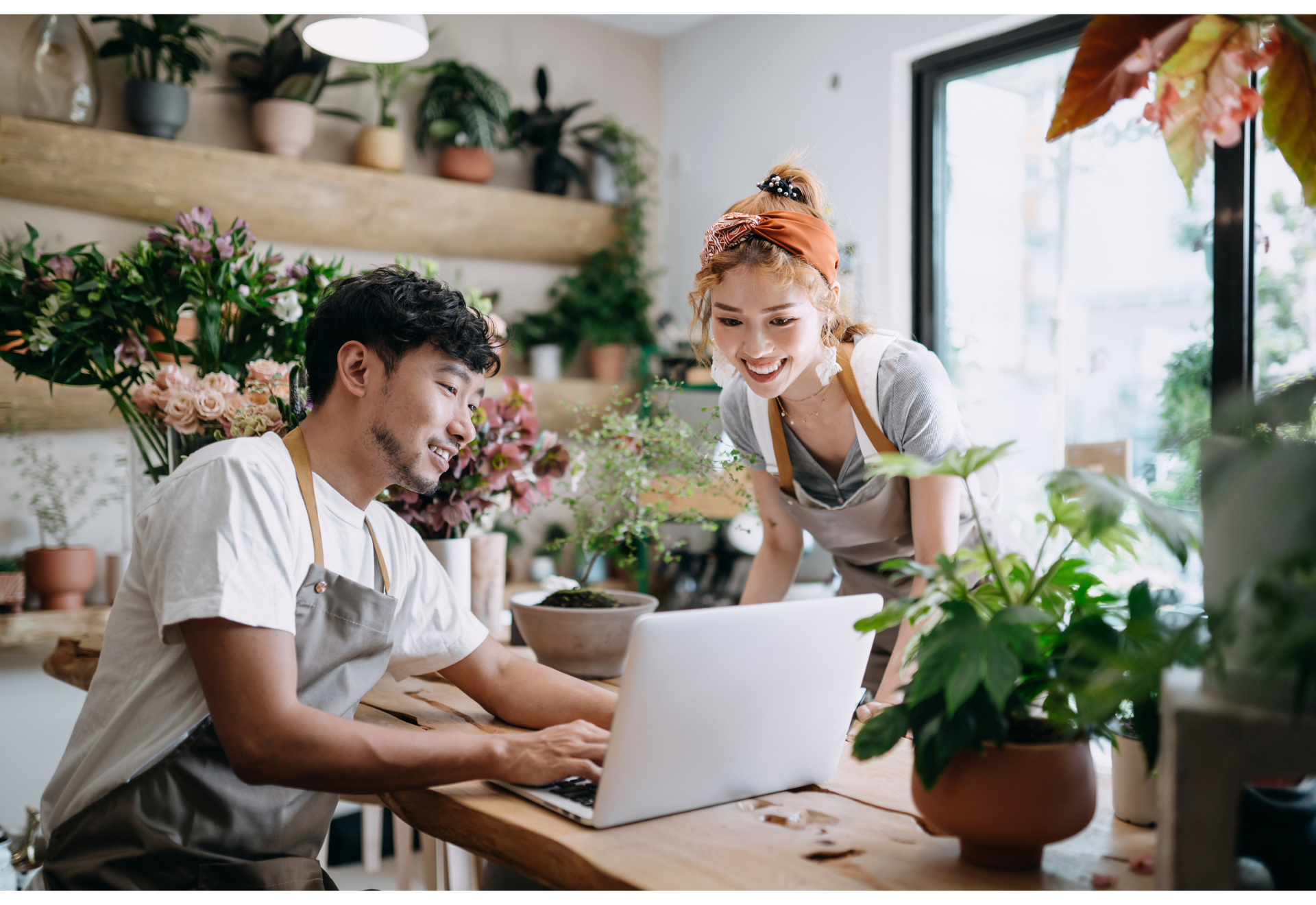 small business owners looking at a laptop